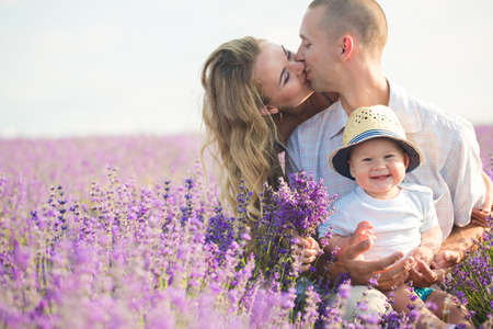 Young family in a lavender fieldの写真素材