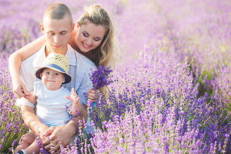 Young family in a lavender fieldの写真素材