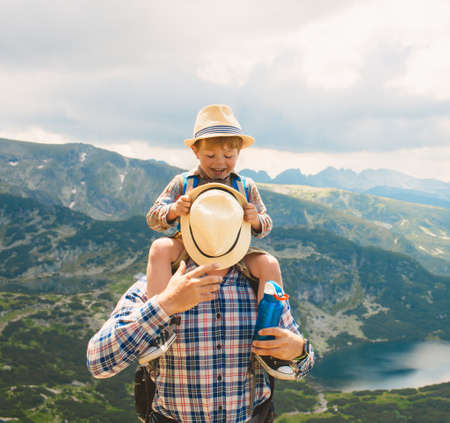 Father and son traveling in Rila mountains Bulgariaの写真素材