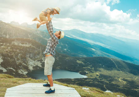 Father and son traveling in Rila mountains Bulgariaの写真素材