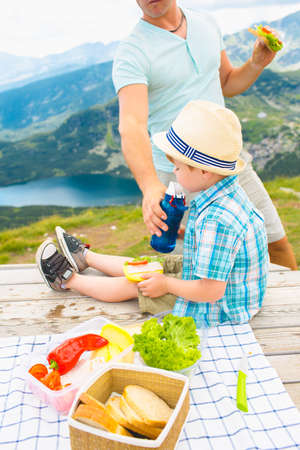 Family on a picnic in the mountainsの写真素材