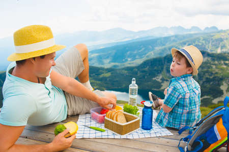 Family on a picnic in the mountainsの写真素材