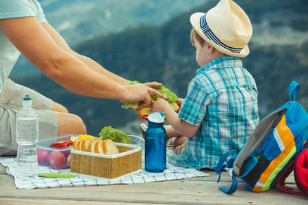Family on a picnic in the mountainsの写真素材