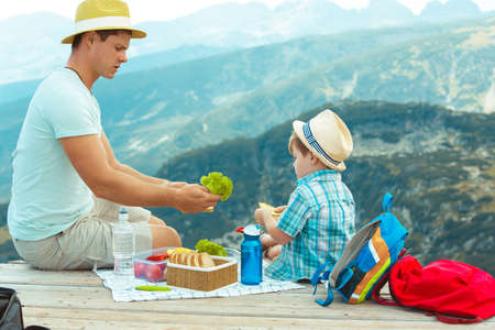 Family on a picnic in the mountainsの写真素材