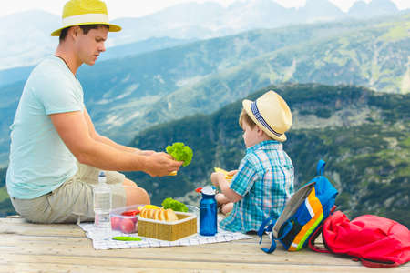 Family on a picnic in the mountainsの写真素材