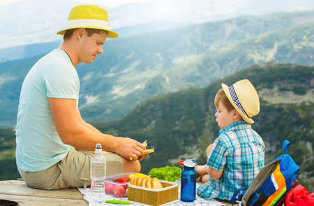 Family on a picnic in the mountainsの写真素材