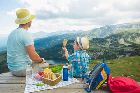 Family on a picnic in the mountainsの写真素材