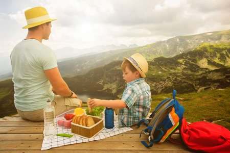 Family on a picnic in the mountainsの写真素材