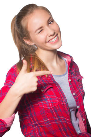 Portrait of teen girl showing dental braces.の写真素材