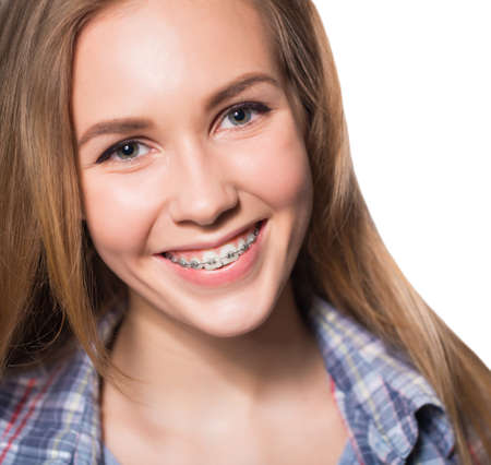 Portrait of teen girl showing dental braces.の写真素材