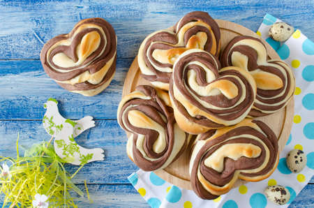 Easter chocolate hot buns Heart on the table. Decorations for Easterの写真素材
