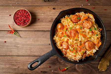 Cabbage stew with grilled sausage - traditional dish of german cuisineの写真素材