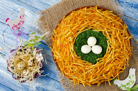 Salad "Nest grouse". Russian traditional salad. Vegetable salad with crispy potatoesの写真素材