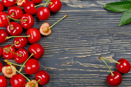 Fresh cherries on a wooden table. Selective focus. Top viewの写真素材