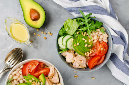 Salmon with white bean, arugula and avocado salad. Healthy eatingの写真素材