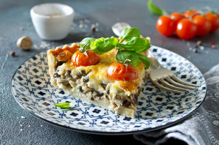 Freshly baked homemade pie quiche Lorraine on a concrete background. Traditional French pastriesの写真素材
