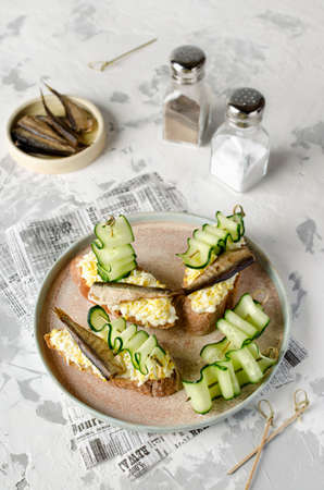 Bruschetta with sprats, egg and cucumber. Fresh foodの写真素材