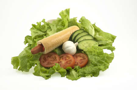isolated hotdog with salat, tomato, cucumberの写真素材