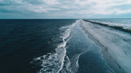 Aerial view of Baltic sea shore with waves and foam, Latvia.の素材