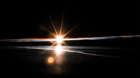 abstract scene of light with rays and lens flare on black backgroundの素材