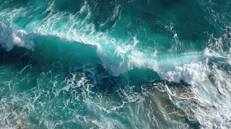 Aerial view of ocean waves breaking on the shore. Top viewの素材