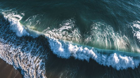 Aerial drone view of ocean waves breaking on the beach. Top viewの素材