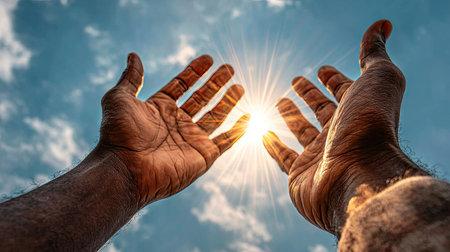 Hands of a man and a woman on a background of the skyの素材