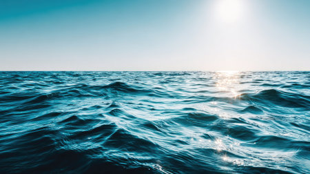 Blue sea water surface with sun reflection in the water. Natural backgroundの素材