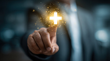 Close up of businessman hand touching glowing cross icon. Success concept.の素材