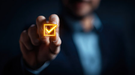 Close up of businessman hand pressing email button on virtual screen with dark backgroundの素材