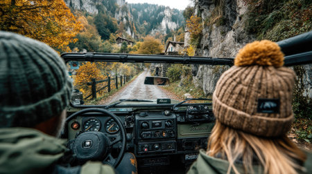 Couple on a road trip in the mountains in autumn. A man and a woman are traveling by car.の素材