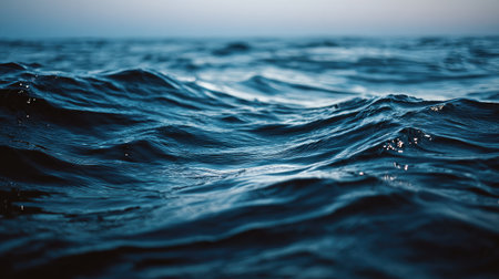 Close up of blue sea water surface with waves and ripples.の素材