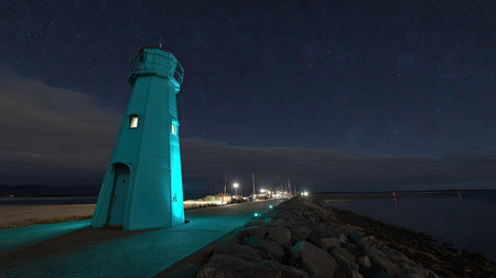 Lighthouse at night with starry sky. Long exposure photography.の素材