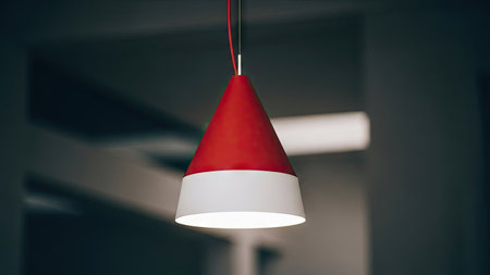 Close up shot of a hanging red and white pendant lamp.の素材