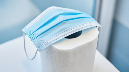 Toilet paper roll and medical mask. Hygiene and health concept.の素材