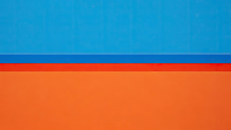 Orange and blue wall background with copy space for text or image.の素材