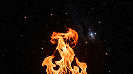 Fire flames on a black background. Fire in the night sky.の素材