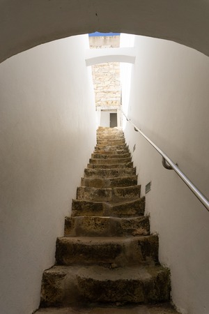 White plaster staircase ancient steps up to church tower in Faro Portugalのeditorial素材