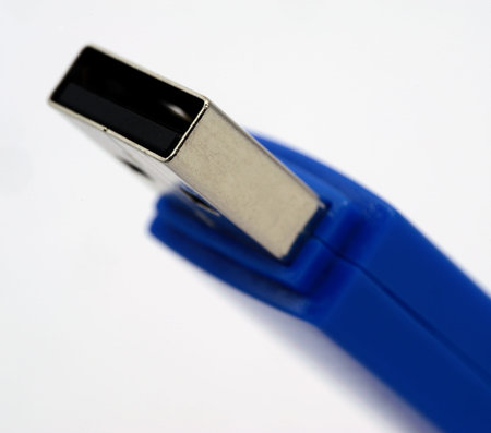 blue usb flash drive isolated over white, with shallow depth of field.の写真素材