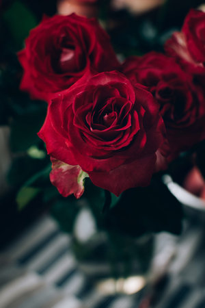 High angel view of bouquet of red roses in vase on the table.の写真素材