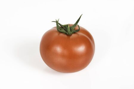 One ripe fresh red tomato isolated on the white backgroundの写真素材