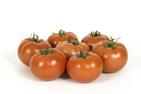 Group of red fresh tomatoes isolated on a white backgroundの写真素材