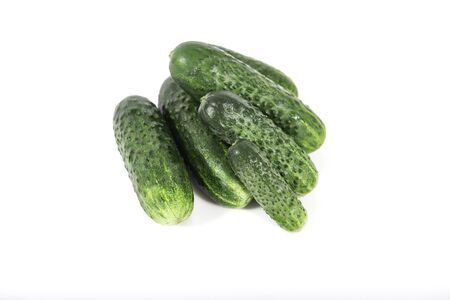 Group of fresh green pickling cucumbers isolated on white backgroundの写真素材