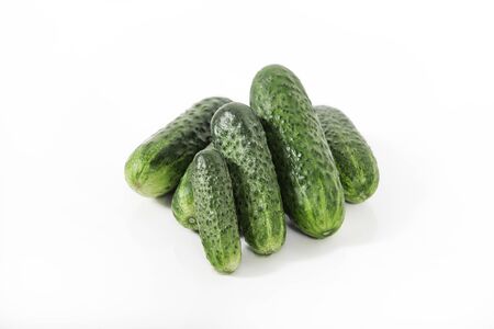 Group of fresh green pickling cucumbers isolated on white backgroundの写真素材