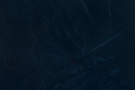 Dark blue textured background. Flat lay. Top view. Space for text. Copy space.