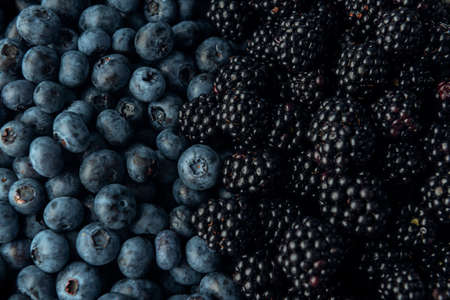 Close-up blueberry and blackberry. Ripe berries texture.の写真素材