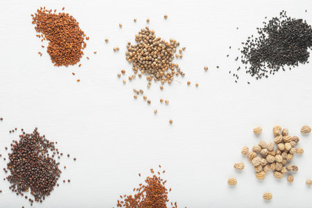Cabbage, watercress, coriander, basil, nasturtium seeds on the white textured background. Top view.の写真素材
