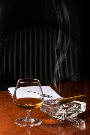 Snifter glass of cognac and cigar の写真素材