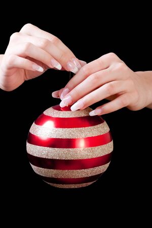 Hands holding christmas ballの写真素材