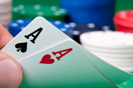 Stack of chips and two aces